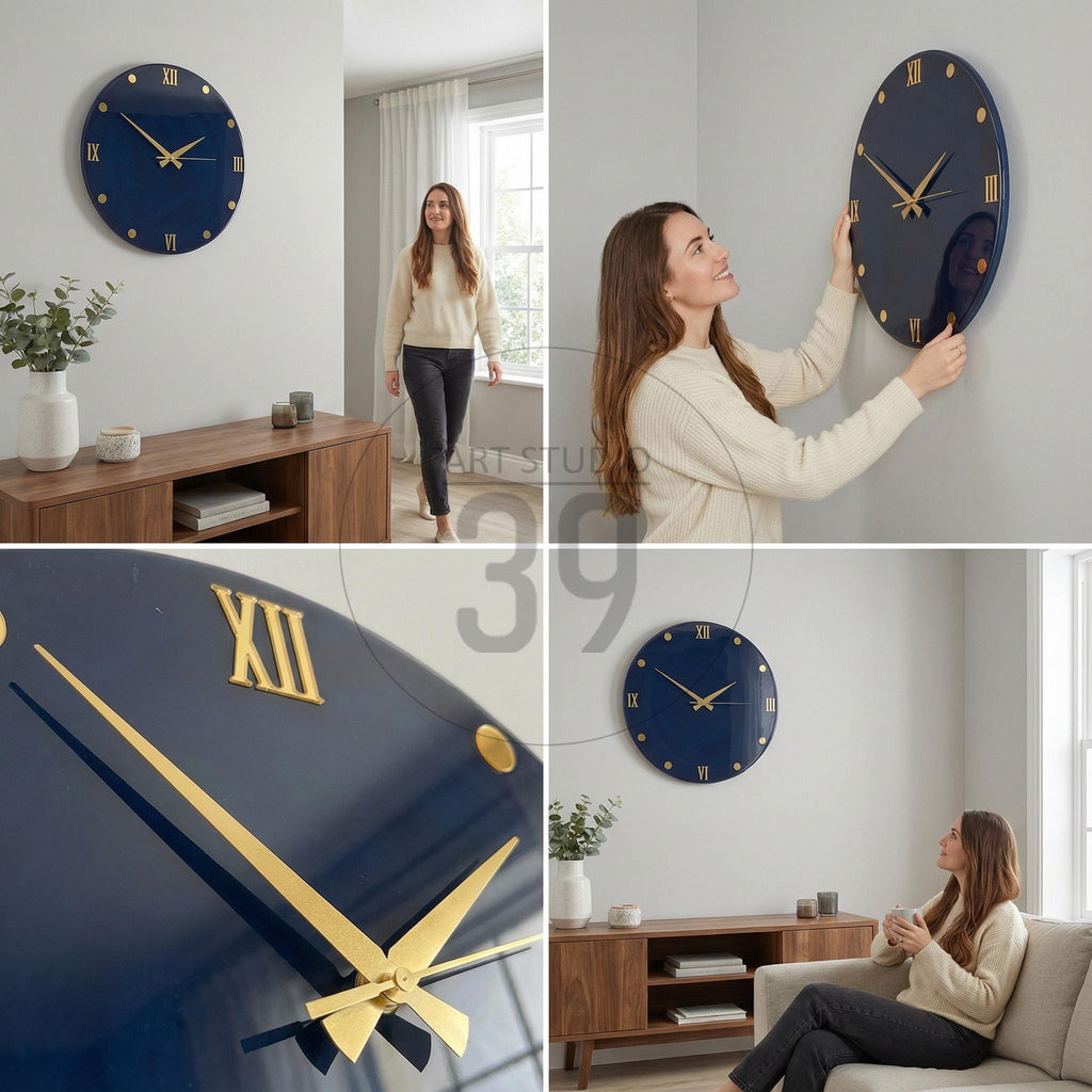 A navy blue wall clock with gold-colored Roman numerals and hands. The clock is round and has a glossy finish. The clock is being hung on a gray wall. The clock is approximately 12 inches in diameter.