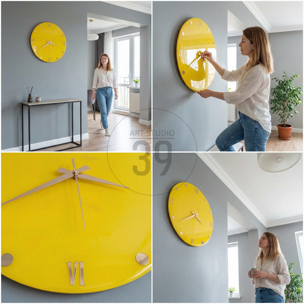 A bright yellow wall clock with gold-colored hands and Roman numeral hour markers. The clock is round and mounted on a gray wall. The clock's design is modern and minimalist, suitable for home decor.