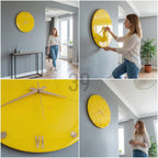 A bright yellow wall clock with gold-colored hands and Roman numeral hour markers. The clock is round and mounted on a gray wall. The clock's design is modern and minimalist, suitable for home decor.