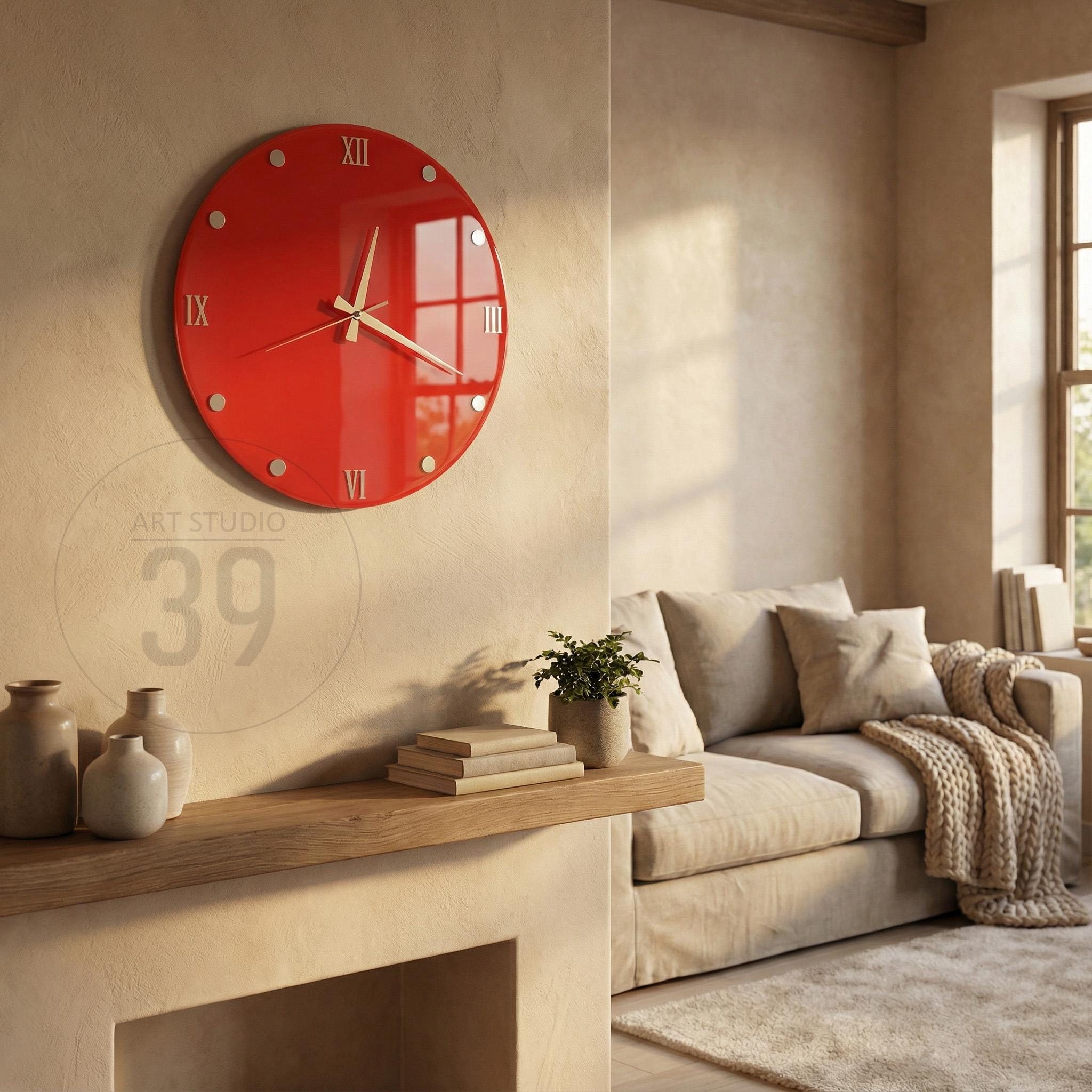A round, red wall clock with Roman numerals and silver accents. The clock is mounted on a beige wall in a living room setting. The clock's hands are light-colored, and the time is approximately 2:30.