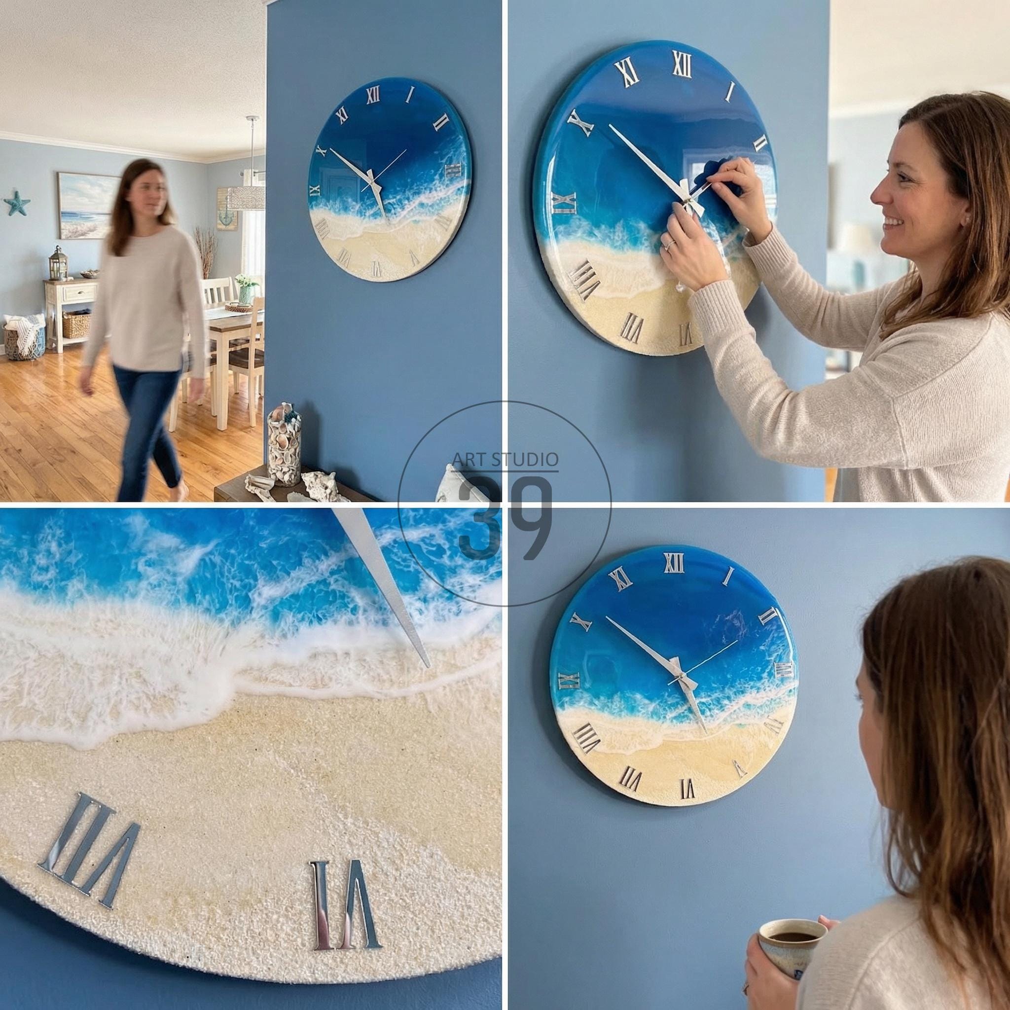 Round wall clock with a beach-themed design. The clock face features a blue ocean and sandy beach design with white Roman numerals. The clock is mounted on a blue wall.