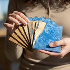 A collection of wooden coasters with a blue resin design. The coasters are rectangular and feature a combination of natural wood and vibrant blue resin, creating a unique and artistic look. The wood has a natural grain.