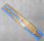 A rectangular wooden art piece with a river-like design. The wood has a natural grain, with sections of blue resin flowing through it. The text "ART STUDIO 39" is visible.