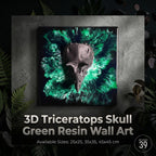 A 3D triceratops skull wall art piece. The skull is dark gray, set against a vibrant green and black resin background. The artwork is square, with available sizes of 25x25, 35x35, and 45x45 cm.