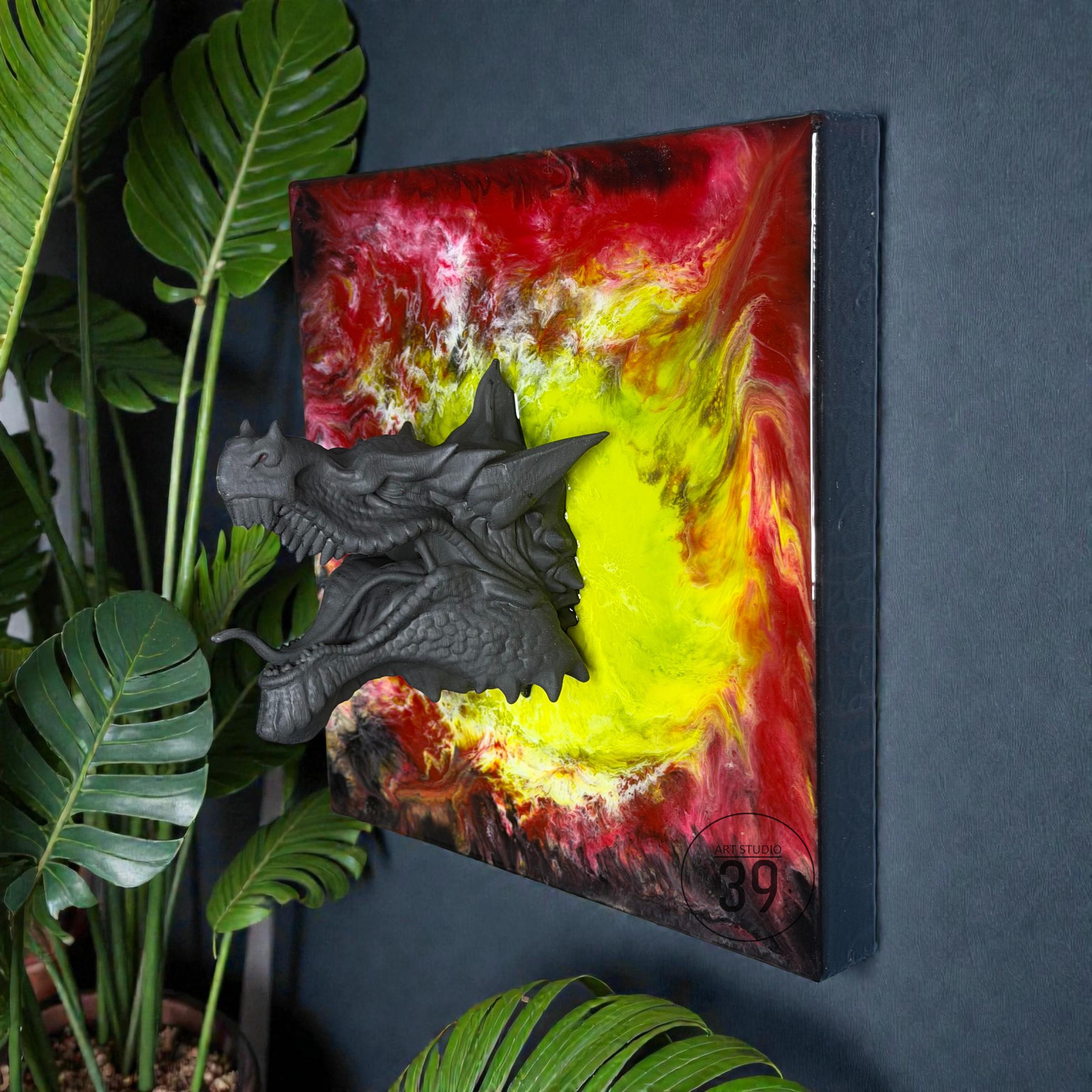 A wall-mounted art piece featuring a dark gray dragon head emerging from a vibrant abstract background. The background blends red, yellow, and white hues. The artwork is framed in a dark color and includes the number 39.