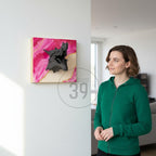 A square wall art piece featuring a dragon head sculpture. The artwork has a pink and gold abstract background. The dragon head is dark gray and appears to be emerging from the canvas. The text "ART STUDIO 39" is in the image.