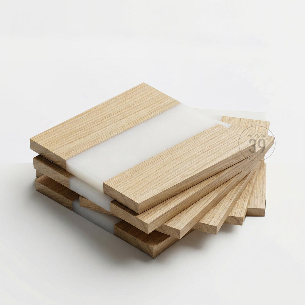 A stack of square wooden coasters with a light wood grain finish and a white resin inlay. The coasters are arranged in a fanned-out pattern, showcasing their design. The coasters are approximately 4 inches square.