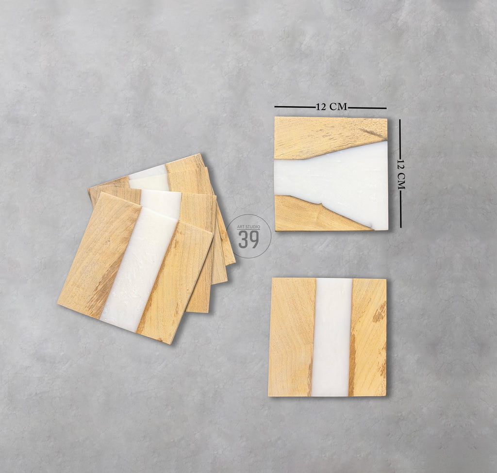 Square wooden coasters with a white resin stripe. Each coaster is 12 cm by 12 cm. The coasters have a natural wood grain pattern. The image includes a stack of coasters and individual coasters.