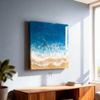 Ocean-themed wall art featuring a resin depiction of a beach scene. The artwork showcases a vibrant blue ocean, foamy white waves, and a sandy shore. The piece is rectangular and mounted on a wall, with the number "39" visible.