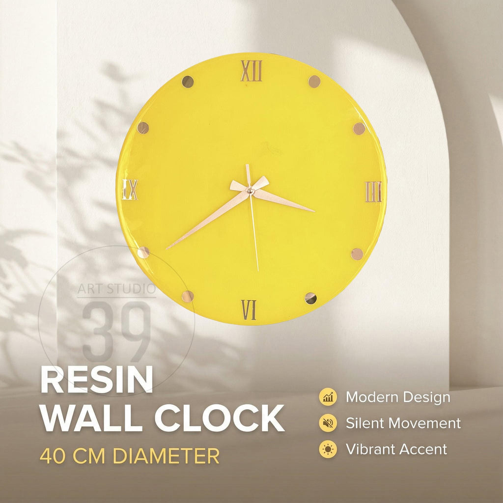 A bright yellow resin wall clock with a 40 cm diameter. The clock features Roman numerals, gold-colored hands, and the text "RESIN WALL CLOCK". The clock has a modern design and silent movement.