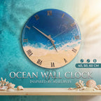 Round wall clock with a beach and ocean design. The clock face features a blue ocean, white waves, and a sandy beach. Roman numerals mark the hours. The clock is available in 40, 50, and 60 cm sizes. The text "OCEAN WALL CLOCK INSPIRED BY MALDIVES" is displayed.