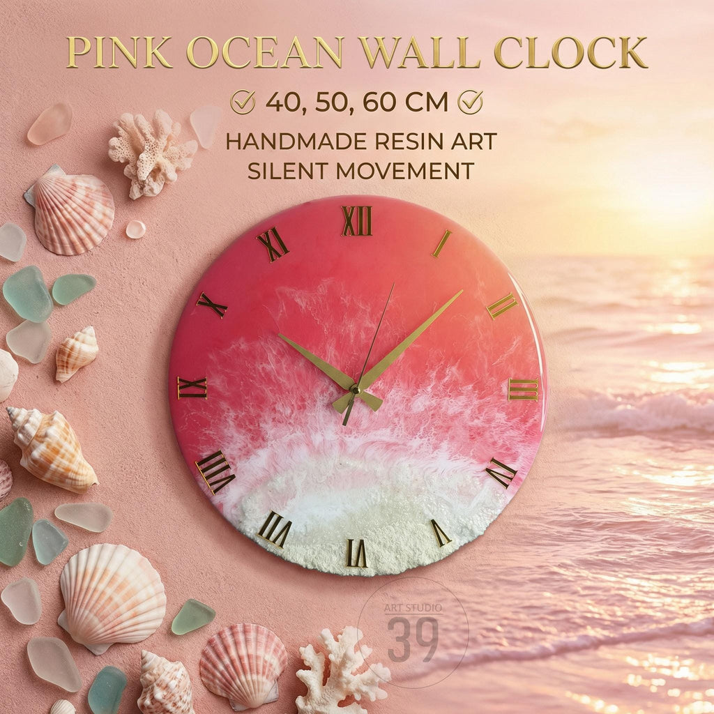Pink Ocean Wall Clock with gold Roman numerals and hands. The clock face features a pink and white resin design, resembling ocean waves. The clock is available in 40, 50, and 60 cm sizes. The image includes seashells and coral.