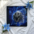 Square artwork featuring a gray dinosaur skull against a blue and white abstract background. The artwork has a glossy finish and includes the number 39 in a circle. Blue flowers are placed around the artwork.