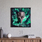 Square wall art featuring a dark gray bird skull sculpture against a vibrant green and black abstract background. The artwork is mounted on a gray wall, with decorative items on a wooden surface below.