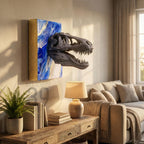 A gray dinosaur skull sculpture emerging from a blue and white abstract art piece, mounted on a wall. The artwork is next to a wooden table with books, a lamp, and a potted plant. The text "ART STUDIO 39" is visible.