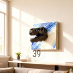 A black dinosaur skull sculpture mounted on a canvas with blue and white abstract paint and gold accents. The canvas is labeled "ART STUDIO 39". The artwork is displayed on a white wall in a living room setting.
