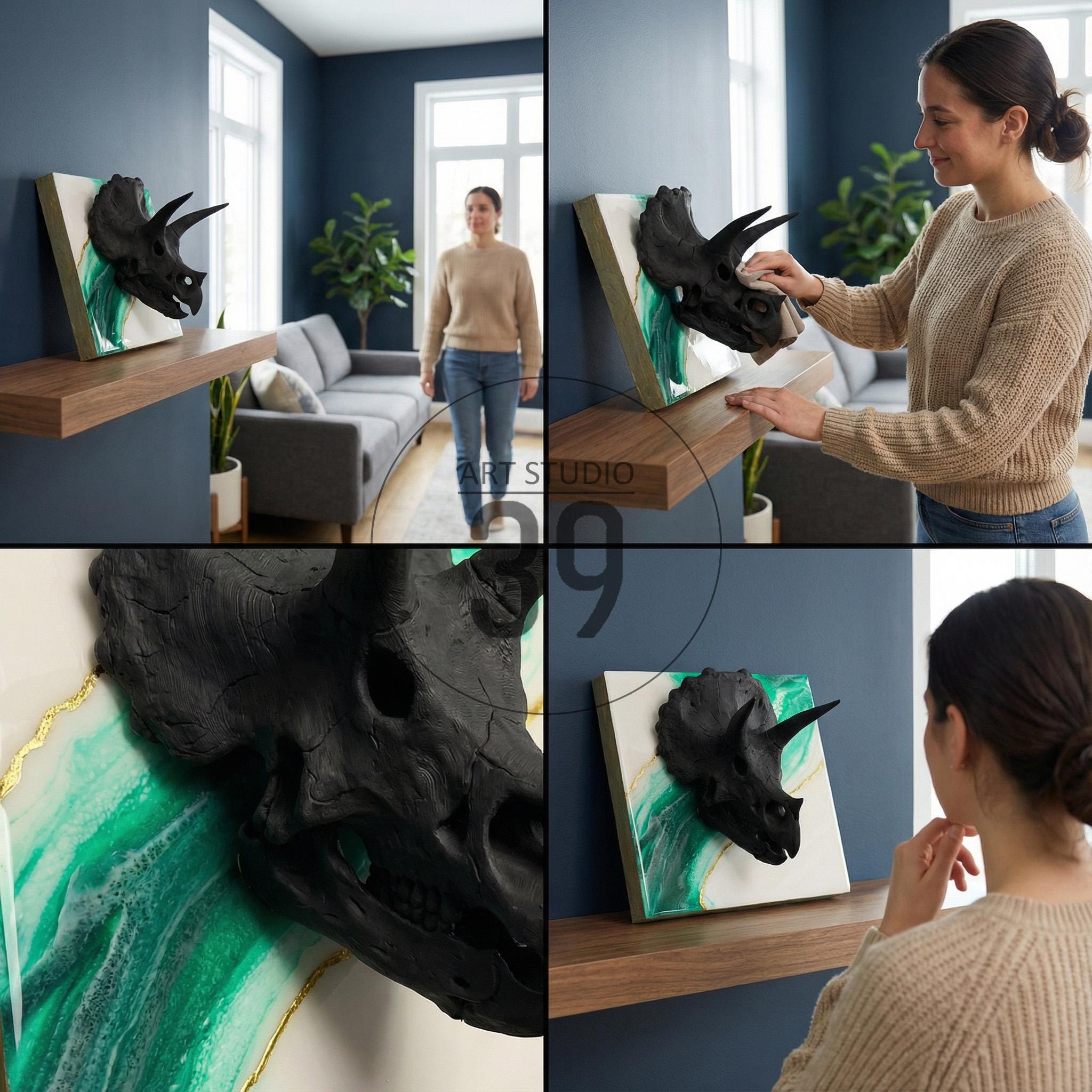 A black triceratops skull sculpture mounted on a white and green abstract background. The artwork is displayed on a wooden shelf against a dark blue wall. The sculpture has a textured appearance.