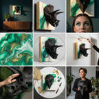 Black triceratops skull sculpture mounted on a square canvas with green and gold abstract paint. The canvas has a white background and gold edges. The artwork is displayed on a wall.