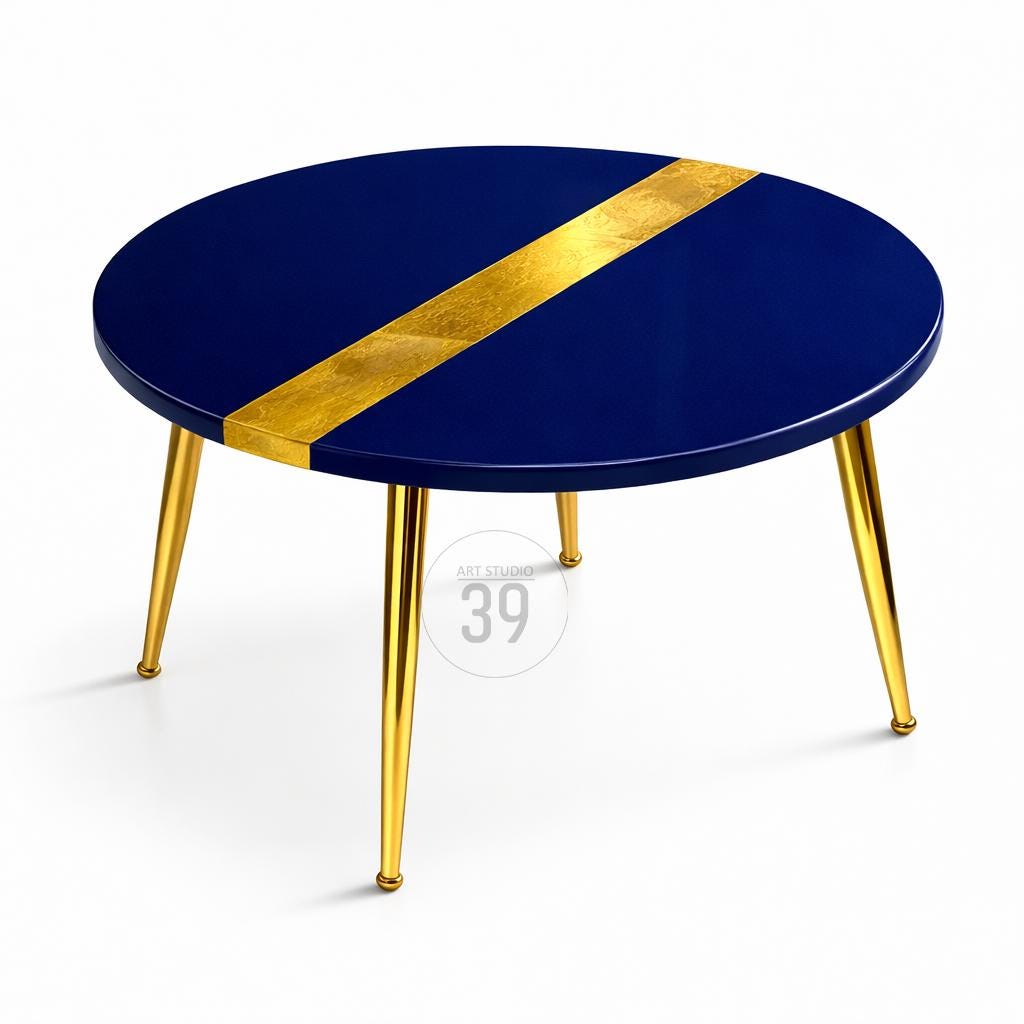 Round coffee table with a navy blue top and a diagonal gold stripe. The table has four gold-colored, tapered legs. The text "ART STUDIO 39" is visible on the table.