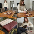 Wooden coasters with a two-tone design. The coasters feature a light wood grain and a deep red resin. The coasters are rectangular and appear to be handmade. The coasters are on a wooden table.
