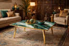 A square coffee table with a green and white marbled top and gold-colored legs. The table is in a living room setting with a sofa, chairs, and decorative items. The table measures approximately 39 inches on each side.