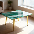 A rectangular coffee table with a green and white marbled design and gold-colored legs. The table has a glossy finish and is supported by four tapered legs. The text "39" is visible on the table.