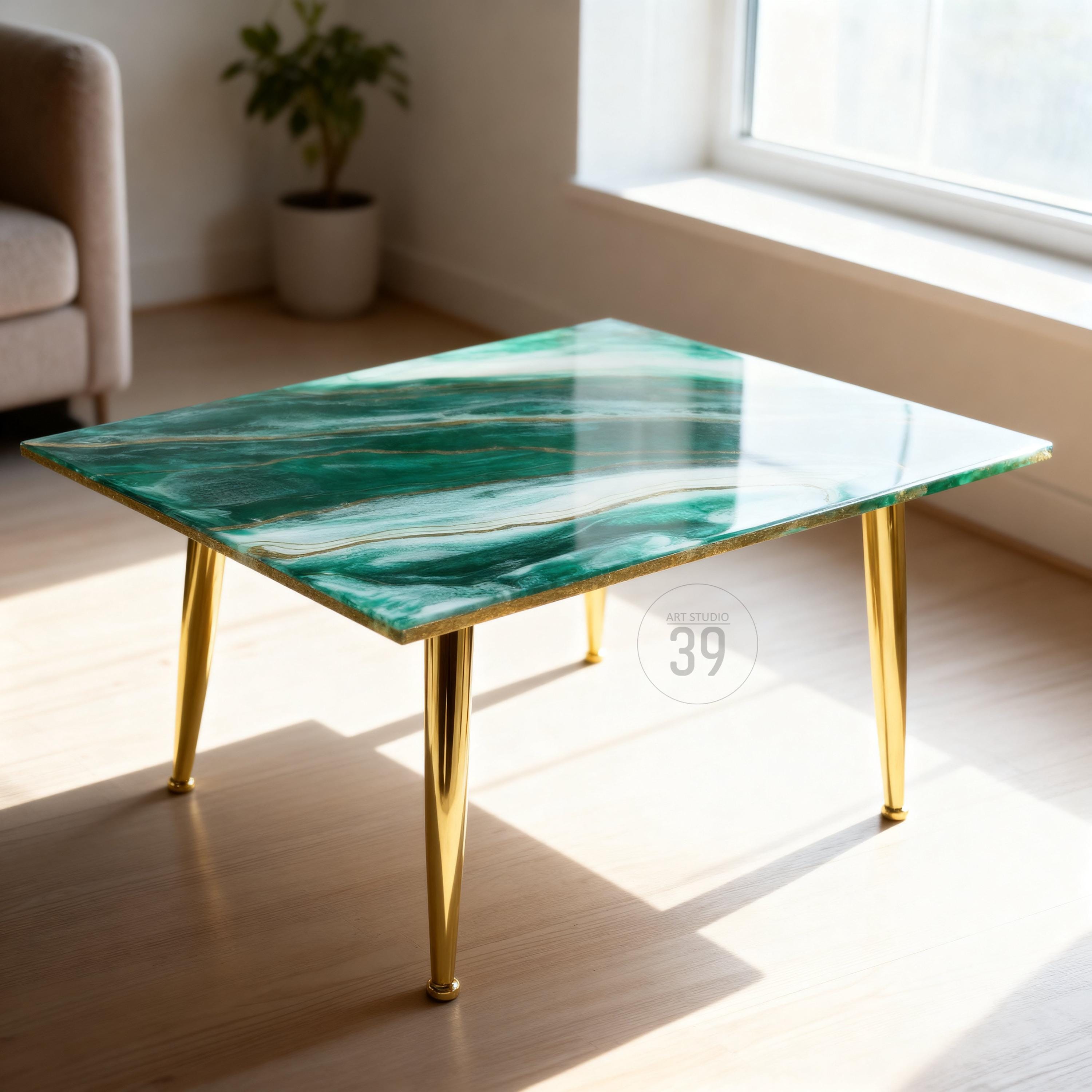 A rectangular coffee table with a green and white marbled design and gold-colored legs. The table has a glossy finish and is supported by four tapered legs. The text "39" is visible on the table.