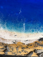 Abstract artwork depicting a beach scene. The image features a deep blue ocean transitioning to turquoise waves, a white foamy shore, and a sandy beach with rocks. The number "39" is visible.