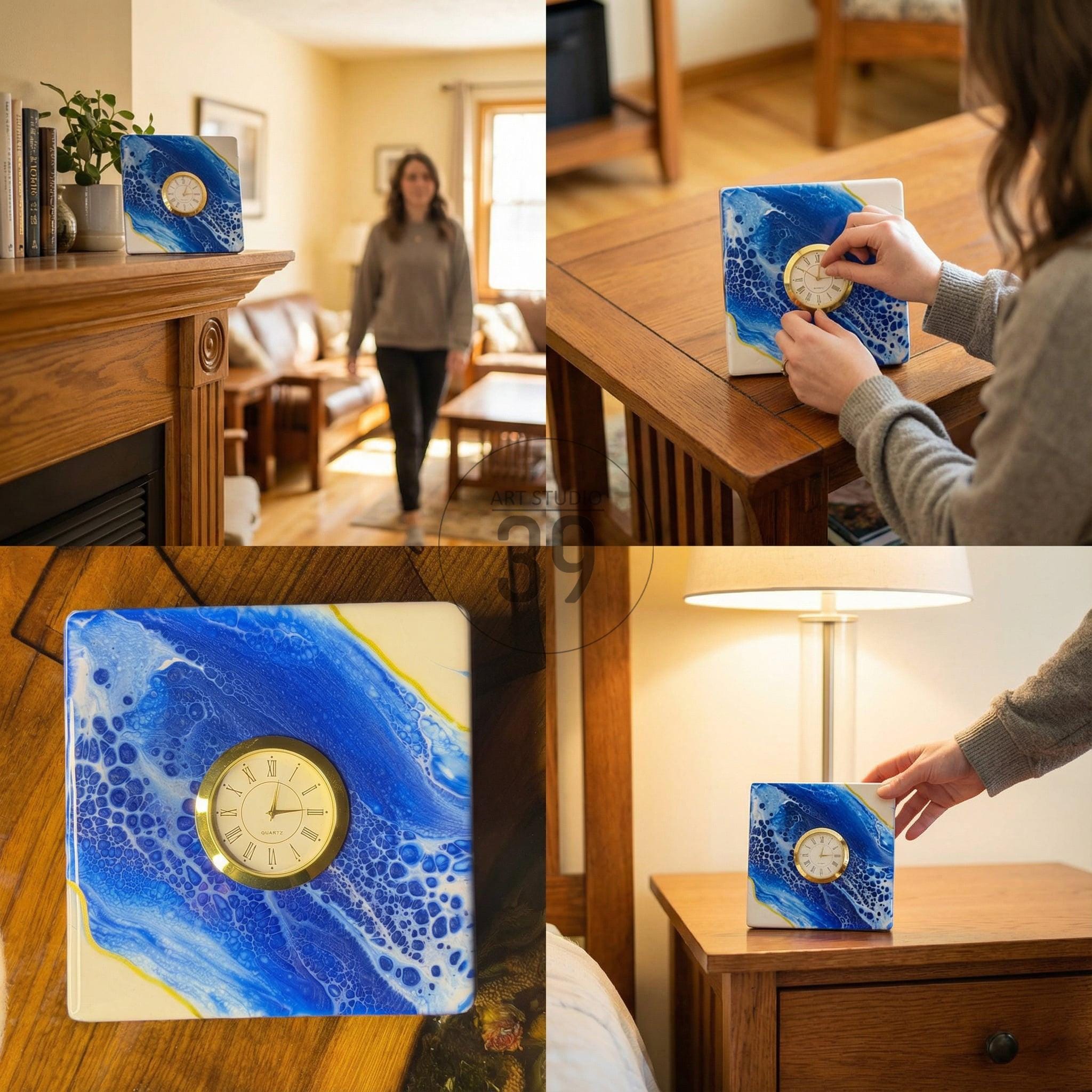 Square clock with a gold-tone clock face and Roman numerals, set within a blue and white abstract design. The clock is displayed on a wooden surface, showcasing a unique decorative piece.
