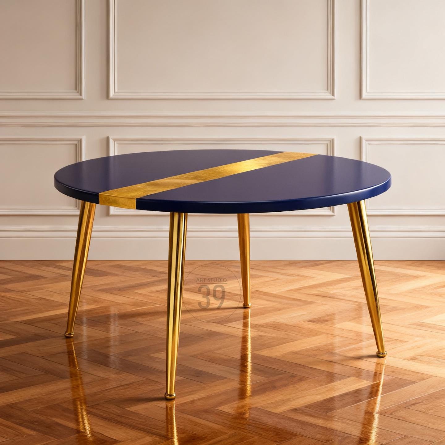 A round navy blue table with a gold stripe across the top. The table has four gold-colored legs. The table is approximately 36 inches in diameter.