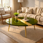A round, green coffee table with a gold stripe and gold legs. The table has a glossy finish and is set on a beige rug. The number "39" is visible on the rug. A small plant and a cup are on the table.