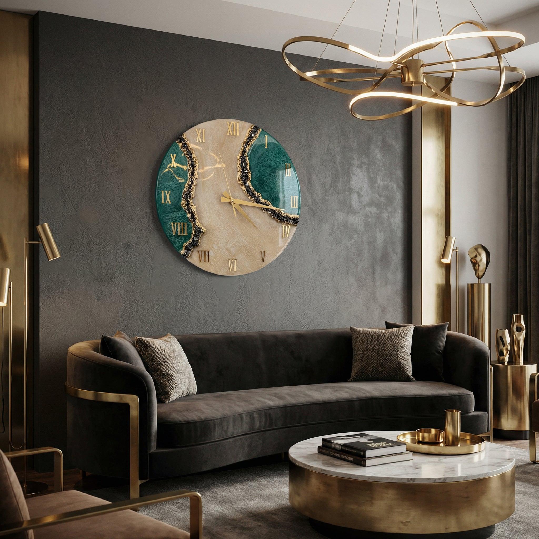 A circular wall clock featuring a beige and deep green marbled face with gold-colored Roman numerals and thin gold hands. The design includes textured, dark, crystalline accents along the edges of the green sections.