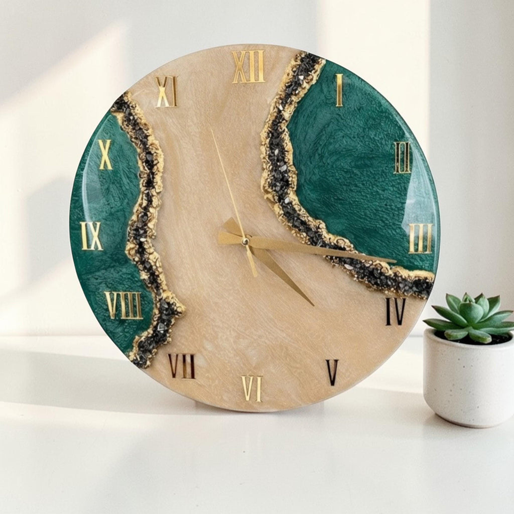 A round wall clock featuring a central beige marbled section flanked by two deep green textured areas. The design includes gold Roman numerals, gold clock hands, and dark crystalline accents along the edges of the green sections.