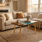 A square coffee table with a wooden top and gold-colored legs. The table's surface features a unique design with a wood grain pattern on one side and a blue and white resin design on the other. The table is 39 inches long.