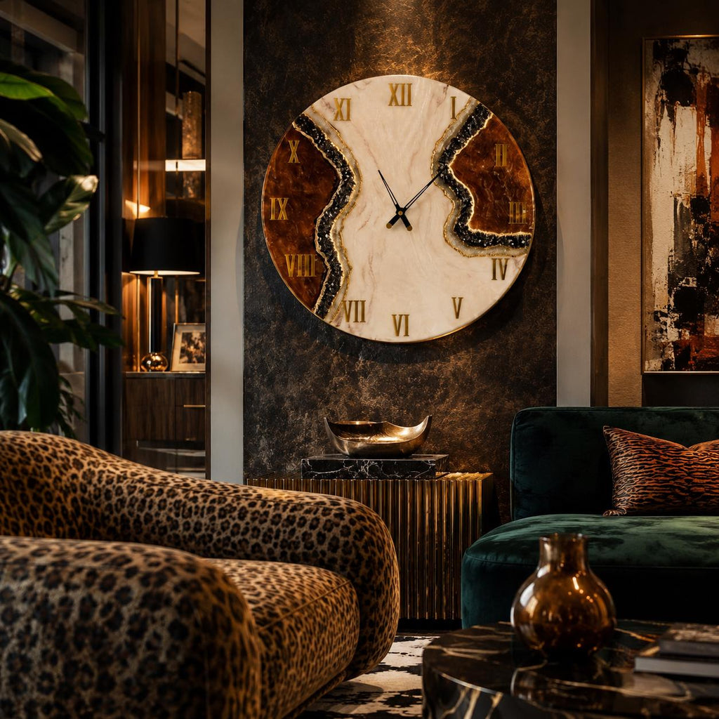 A large round wall clock featuring a cream-colored center with a jagged, dark brown and gold-flecked resin border. The clock face displays gold Roman numerals and thin black hands, mounted on a dark, textured wall above a gold console.
