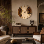 A large circular wall clock featuring a cream-colored face with a central vein of dark brown and black textured material. The clock displays black Roman numerals and thin black hands, mounted on a wall above a wooden sideboard.
