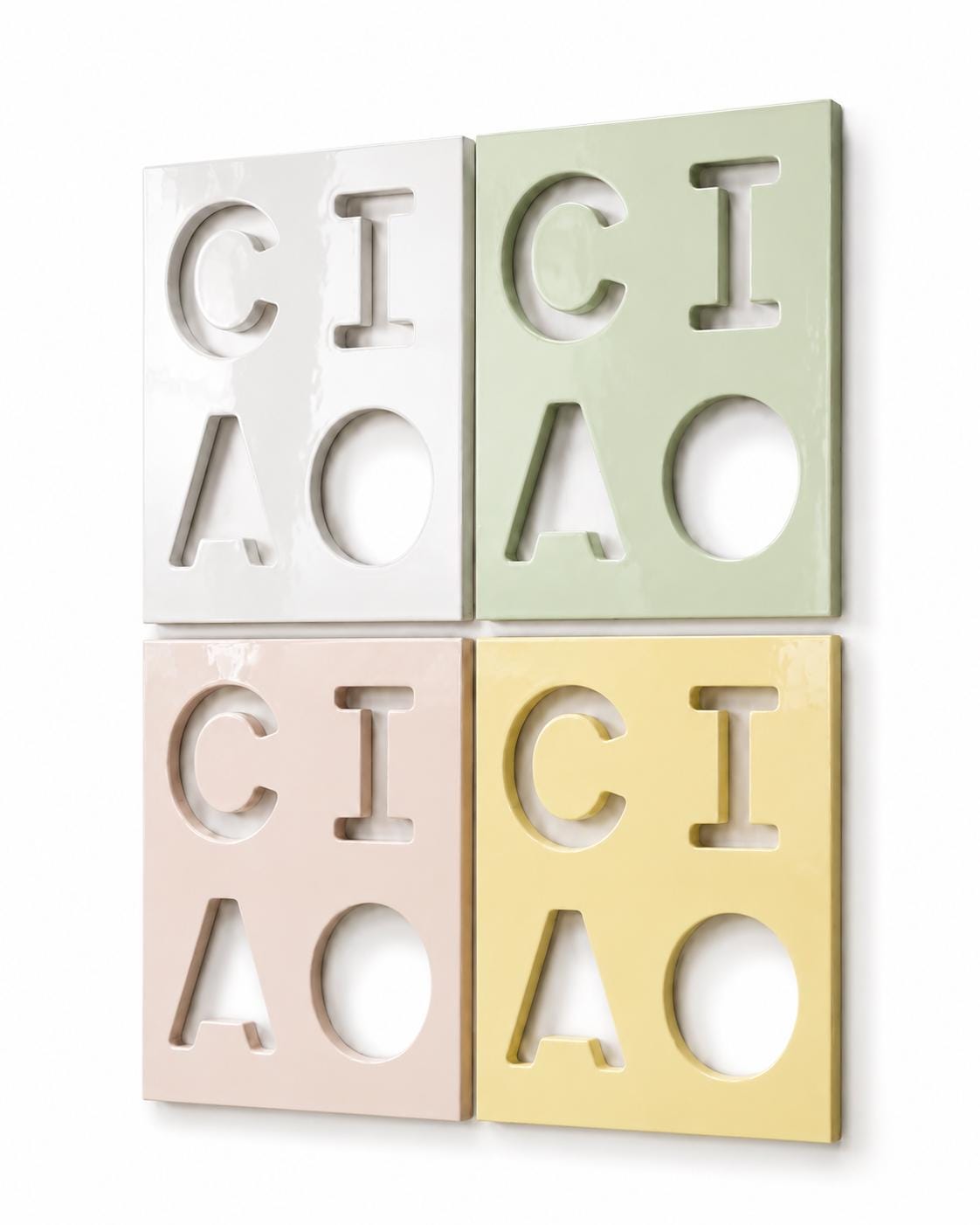 Four rectangular wall tiles arranged in a square grid. Each tile features cut-out letters spelling CICI and CIAO. The tiles are colored white, light green, pale pink, and soft yellow, all with a smooth, glossy, reflective finish.
