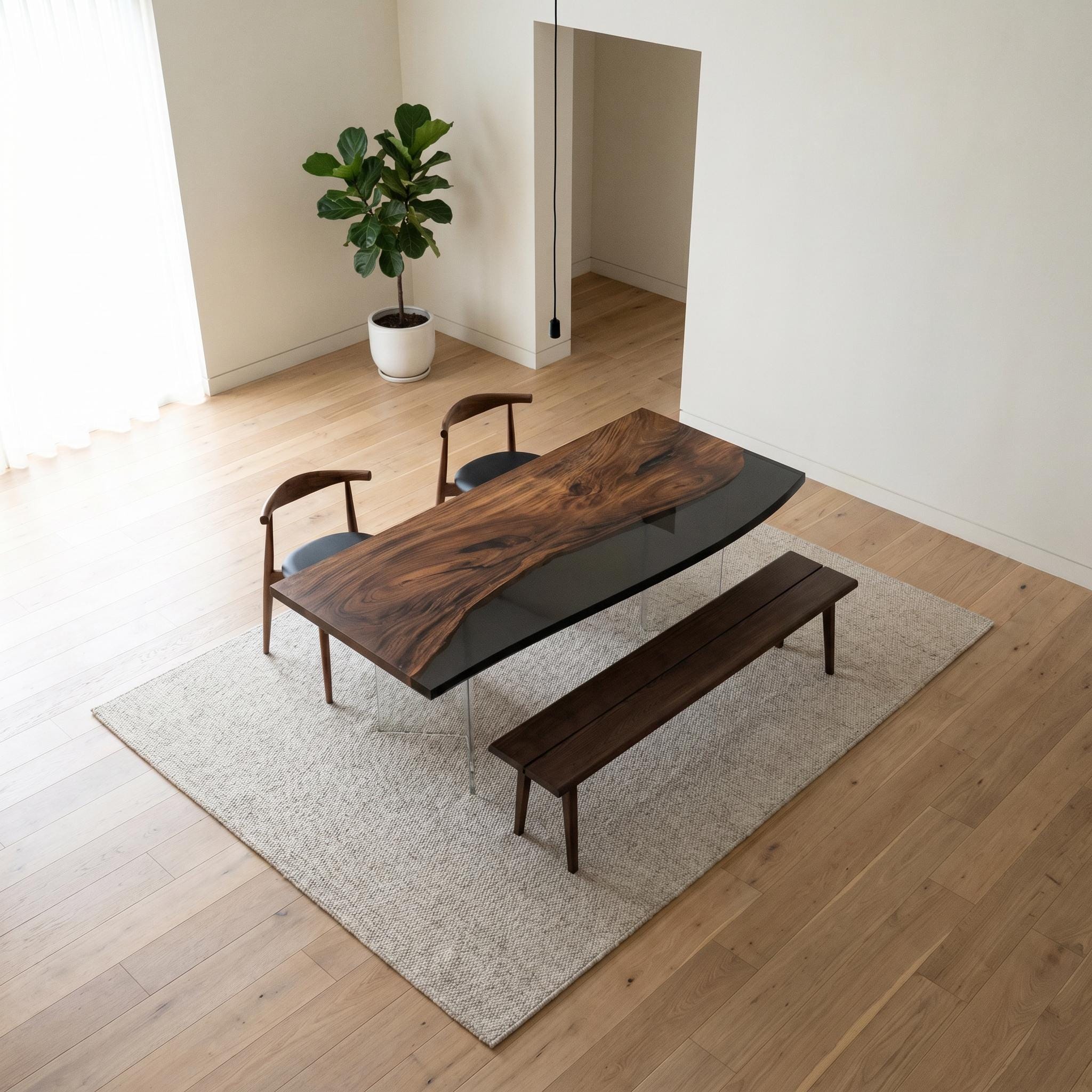 A dining set featuring a rectangular table with a live-edge dark wood top and a black glass section, two curved wooden chairs with dark seats, and a long wooden bench, all positioned on a light-colored rectangular area rug.