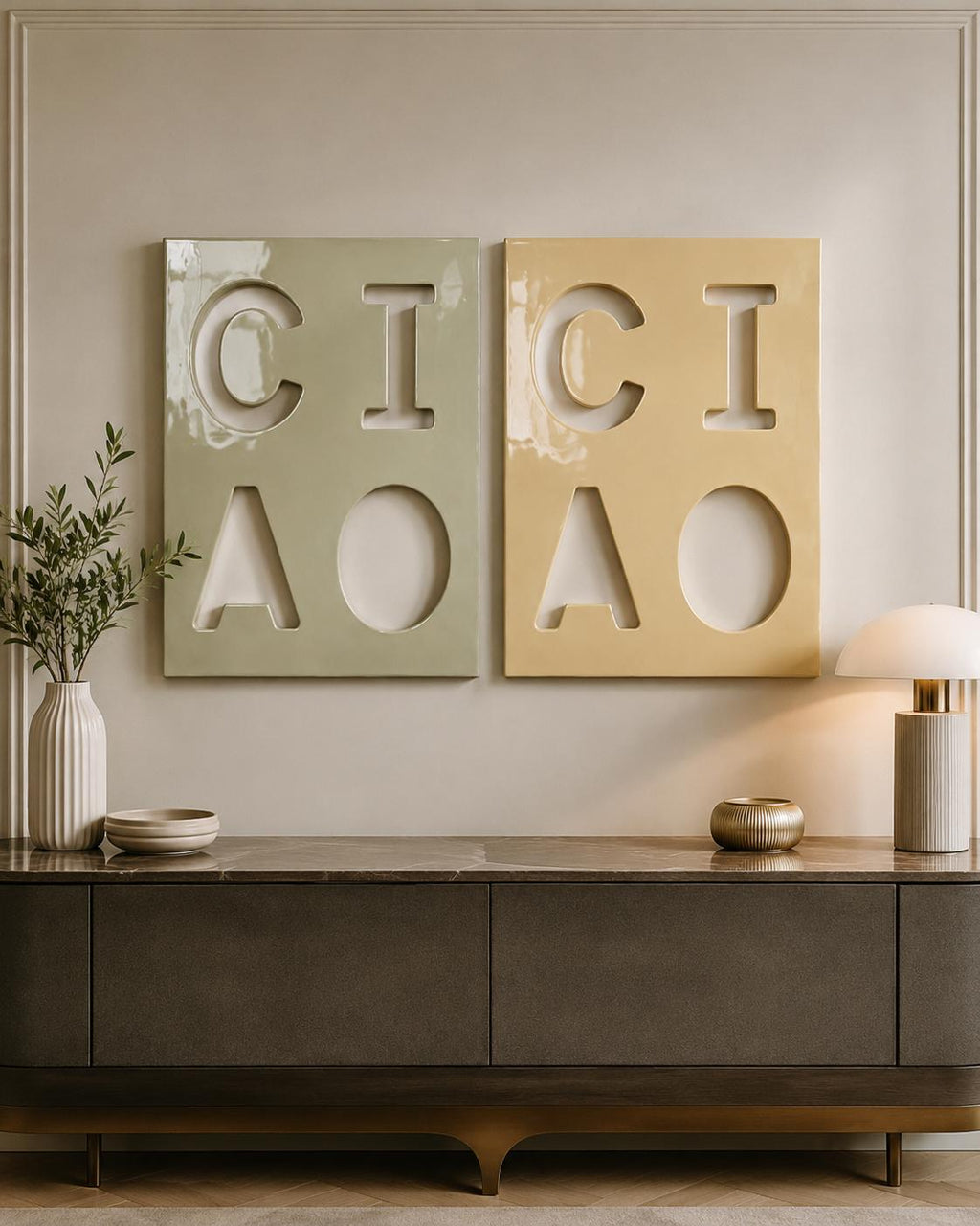 Two rectangular wall art panels featuring cut-out letters. The left panel is sage green with the letters C, I, A, and O. The right panel is mustard yellow with the same letters C, I, A, and O. Both panels have a glossy, smooth finish.