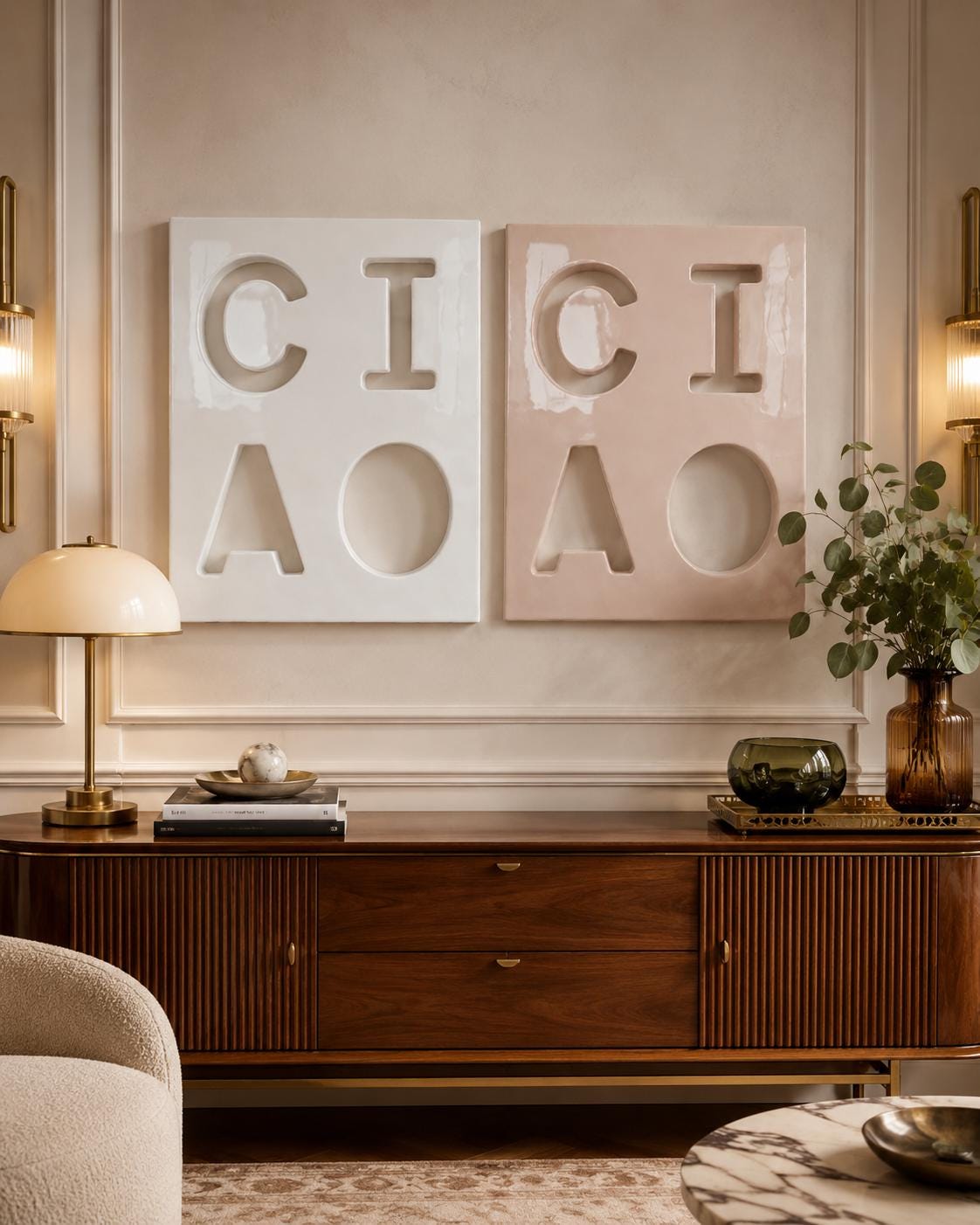 Two rectangular wall art panels featuring recessed cutouts of the letters C, I, C, and A. One panel is white and the other is a soft dusty pink. Each panel displays the letters arranged in a two-by-two grid with a smooth, matte finish.