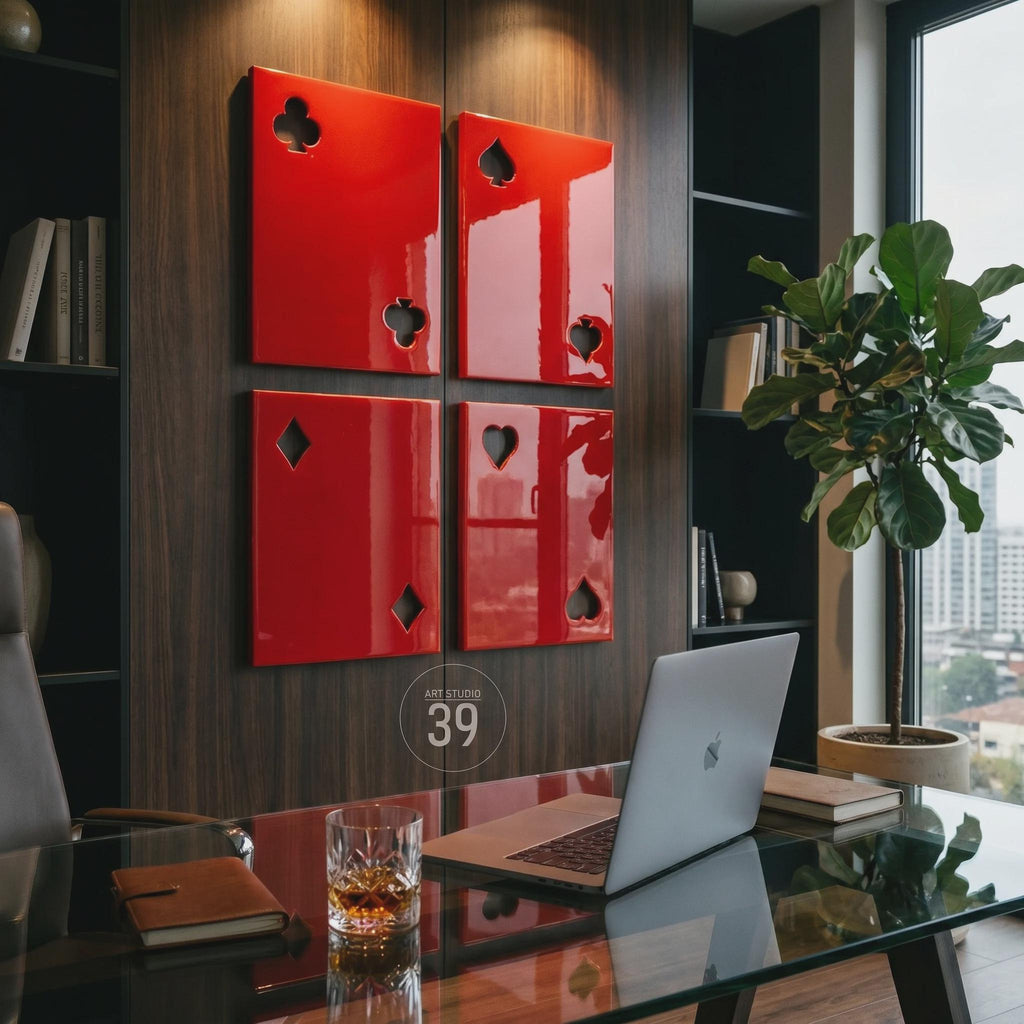 Four rectangular wall panels in a glossy red finish, each featuring a cutout of a playing card suit. The top left panel shows a club, the top right a spade, the bottom left a diamond, and the bottom right a heart. A circular logo with the text ART STUDIO 39 is visible.