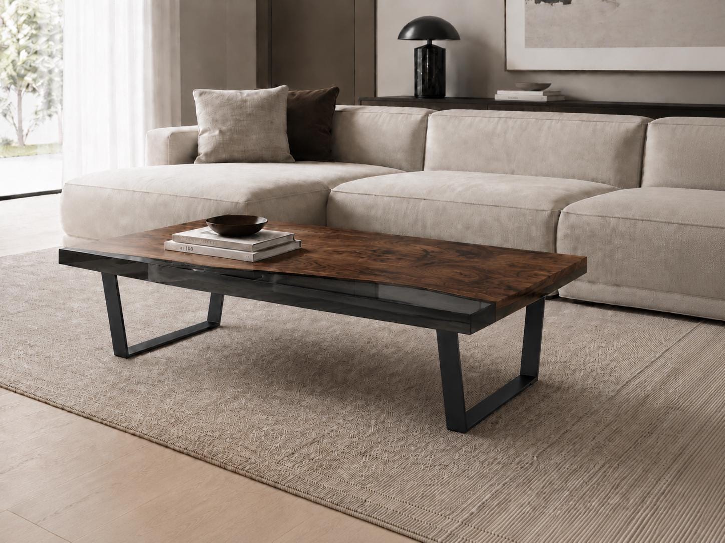 A rectangular coffee table featuring a dark brown wood grain top with a smooth finish and a clear glass inlay section. The table is supported by four black metal legs arranged in a wide, angled U-shape design, providing a stable base.