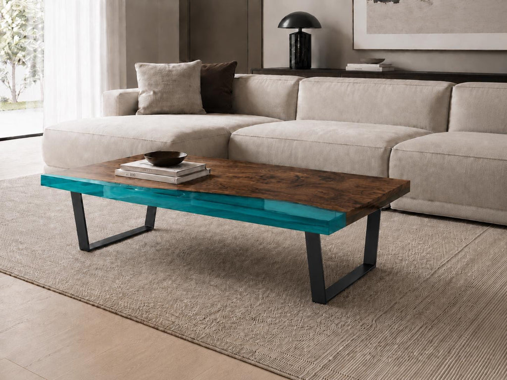 A rectangular coffee table featuring a dark brown wood grain surface with a vibrant, translucent turquoise resin edge. The table is supported by two black metal U-shaped legs, providing a stable base for the wooden and resin tabletop.