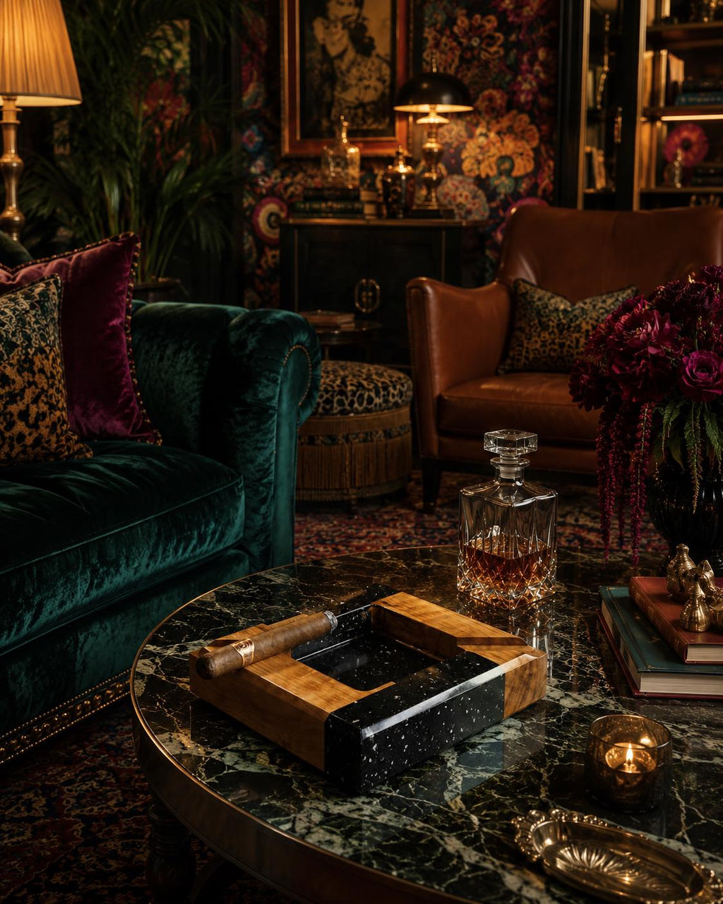 A square cigar ashtray featuring a combination of light brown wood and a black speckled resin insert. The ashtray has a wide wooden rim with a dedicated groove for resting a cigar, and it is placed on a dark green marble table.