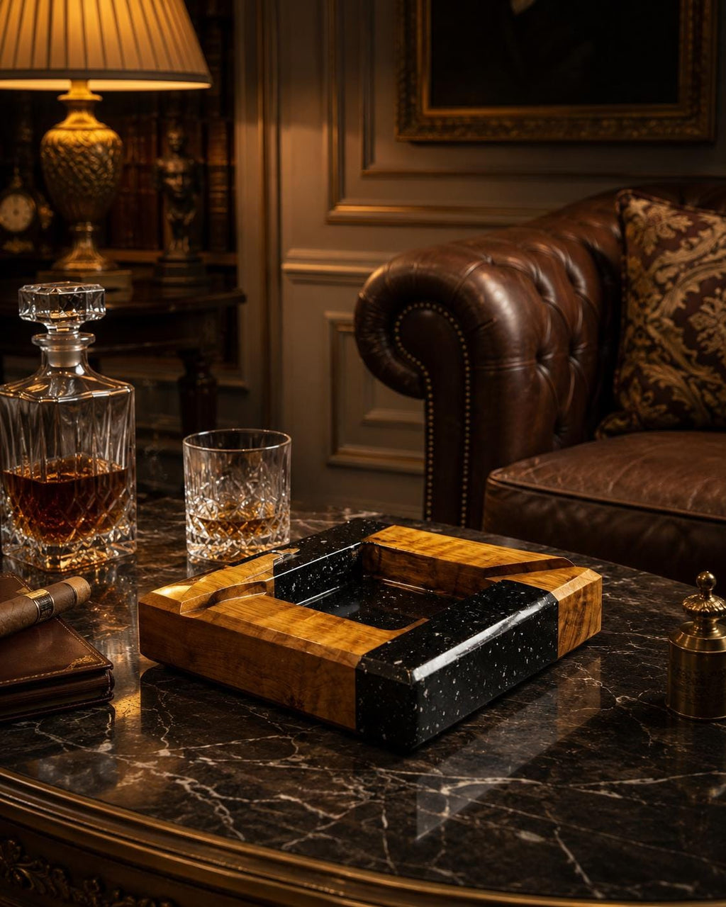 A square ashtray featuring a combination of polished natural wood with a prominent grain and a contrasting black resin section speckled with white flecks. The ashtray has four integrated notches for resting cigars or cigarettes.