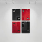 Four rectangular wall panels arranged in a grid, each featuring a glossy finish and a cutout representing a playing card suit. The top left is black with a club, top right is red with a heart, bottom left is red with a diamond, and bottom right is black with a spade.