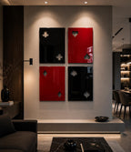 Four rectangular wall panels arranged in a grid, featuring glossy surfaces in black and red. Each panel displays two cut-out shapes representing playing card suits: clubs, hearts, diamonds, and spades, with a smooth, reflective finish.