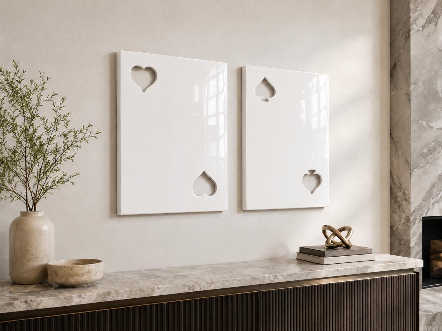 Two rectangular white wall art panels with a glossy finish. The left panel features cutouts of a heart in the top left and bottom right corners. The right panel features cutouts of a spade in the top left and bottom right corners.